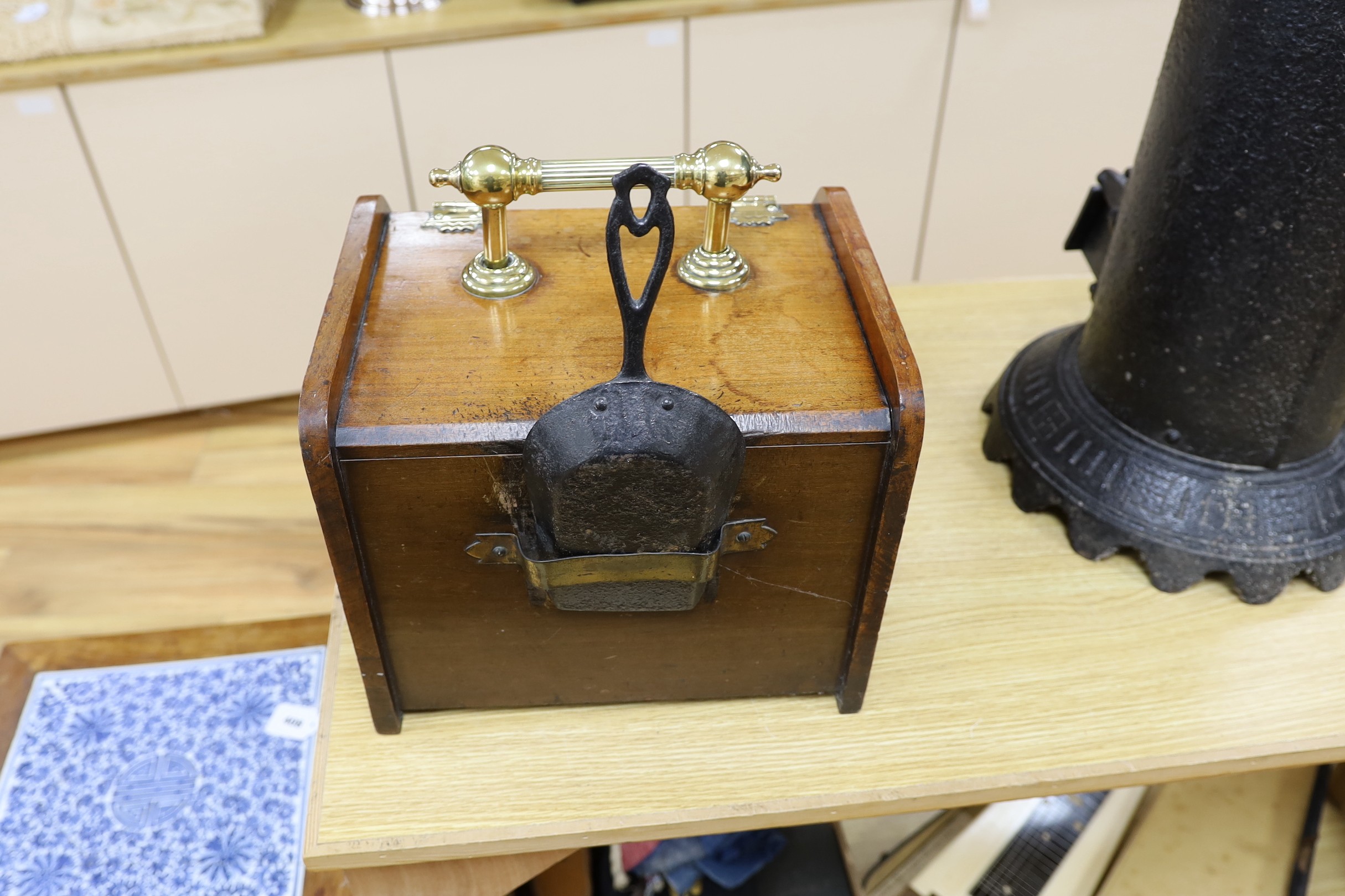 An Edwardian walnut brass handled and hinged perdonium, 28cms high x 45cms deep